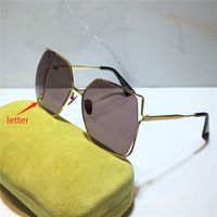 gold dark purple grey lens with letter
