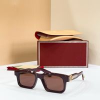 Red gold frame brown lens