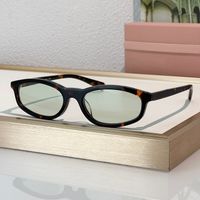 Amber frame green lens