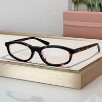Amber frame clear lens