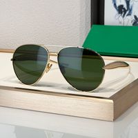 Gold frame green lens