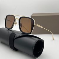 Black gold frame brown lens