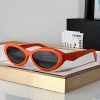 Orange frame grey lens
