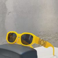 yellow gold frame grey lens