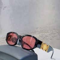 black gold frame red lens