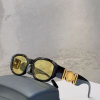 black gold frame yellow lens