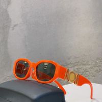 Orange gold frame grey lens