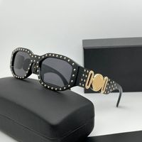 Nailed black gold frame grey lens