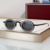 Black white frame grey lens