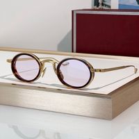 Amber gold frame pink lens