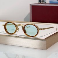Amber gold frame light green lens