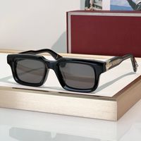 Black gold frame grey lens